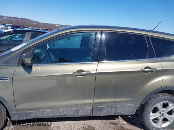 2013 Ford Escape SE with VIN 1FMCU0GX4DUC60741, listed as a IAAI auction lot 41592770 with 121,972 mi miles and . Bid and sale history available at DreamBid. Image 14.