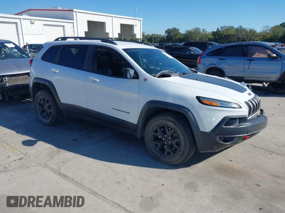 2018 Jeep Cherokee Trailhawk z VIN 1C4PJMBX8JD562994, wystawiony jako IAAI lot #41281555 z przebiegiem 86 702 mil mil oraz . Historia ofert i sprzedaży dostępna na DreamBid. Obrazek 1.