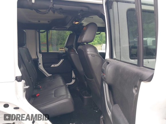 2014 Jeep Wrangler Unlimited Rubicon with VIN 1C4HJWFG4EL104827, listed as a IAAI auction lot 42236622 with 90,935 mi miles and . Bid and sale history available at DreamBid. Image 8.