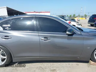 2014 Infiniti Q50 Premium with VIN JN1BV7AP5EM672766, listed as a IAAI auction lot 42107952 with 66,929 mi miles. Bid and sale history available at carsss.com. Image 13.
