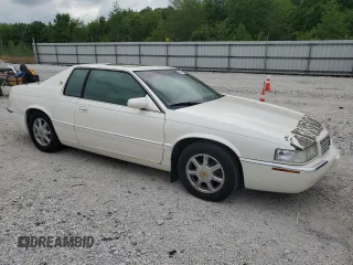 2000 Cadillac Eldorado Touring with VIN 1G6ET1298YB702875, listed as a Copart auction lot 54434255 with 135,282 mi miles and Salvage Title. Bid and sale history available at DreamBid. Image 4.