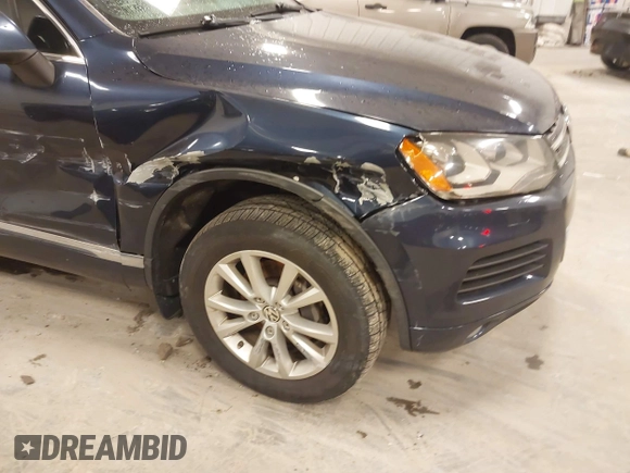 2014 Volkswagen Touareg Sport with VIN WVGEF9BP9ED008967, listed as a IAAI auction lot 41984409 with 193,859 mi miles and . Bid and sale history available at DreamBid. Image 6.