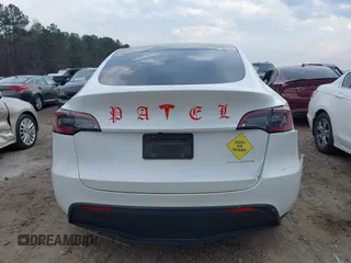 2023 Tesla Model Y Long Range with VIN 7SAYGDEE2PF765395, listed as a IAAI auction lot 41688080 with 27,792 mi miles and . Bid and sale history available at DreamBid. Image 16.