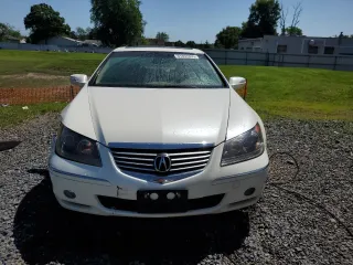 2006 Acura RL z VIN JH4KB16576C012132, wystawiony jako Copart lot #61897805 z przebiegiem 143 101 mil mil oraz Szkoda całkowita • Salvage title. Historia ofert i sprzedaży dostępna na DreamBid. Obrazek 5.