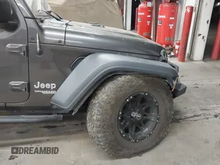 2020 Jeep Wrangler Sport S with VIN 1C4GJXAN4LW229040, listed as a IAAI auction lot 42172180 with 58,701 mi miles and . Bid and sale history available at DreamBid. Image 6.