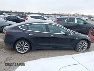2018 Tesla Model 3 Long Range Battery with VIN 5YJ3E1EB9JF188437, listed as a IAAI auction lot 41371254 with 55,934 mi miles and . Bid and sale history available at DreamBid. Image 13.