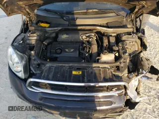 2015 MINI Countryman S with VIN WMWZC5C57FWP48606, listed as a Copart auction lot 47212255 with 104,922 mi miles and Salvage Title. Bid and sale history available at DreamBid. Image 11.