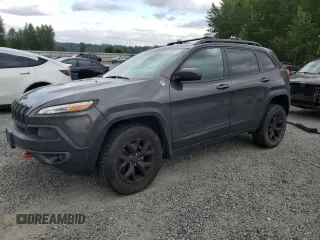 2017 Jeep Cherokee Trailhawk z VIN 1C4PJMBS0HW577055, wystawiony jako Copart lot #56428235 z przebiegiem 137 296 mil mil oraz Szkoda całkowita • Salvage title. Historia ofert i sprzedaży dostępna na DreamBid. Obrazek 1.