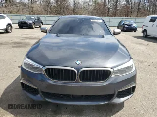 2018 BMW 5 Series M550i xDrive with VIN WBAJB9C57JB286734, listed as a Copart auction lot 52711235 with 127,450 mi miles and Salvage title. Bid and sale history available at DreamBid. Image 5.