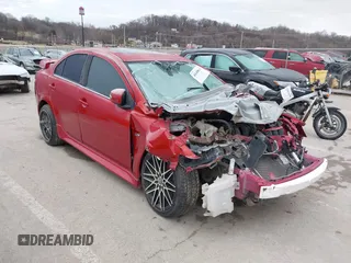 2016 Mitsubishi Lancer GT with VIN JA32U8FW1GU012988, listed as a IAAI auction lot 41498905 with 94,727 mi miles. Bid and sale history available at carsss.com. Image 1.