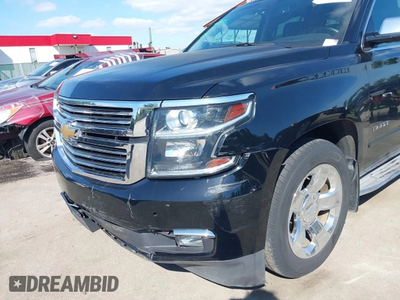 2015 Chevrolet Tahoe LTZ z VIN 1GNSKCKC3FR104845, wystawiony jako IAAI lot #42291785 z przebiegiem 75 047 mil mil oraz . Historia ofert i sprzedaży dostępna na DreamBid. Obrazek 19.