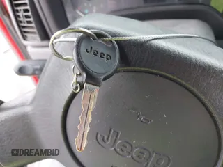 1998 Jeep Wrangler SE with VIN 1J4FY29P2WP791317, listed as a IAAI auction lot 41748523 with 169,052 mi miles. Bid and sale history available at carsss.com. Image 11.