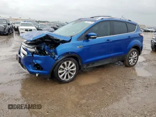 2018 Ford Escape Titanium with VIN 1FMCU9J98JUB31234, listed as a Copart auction lot 58817705 with 140,183 mi miles and Salvage title. Bid and sale history available at DreamBid. Image 1.