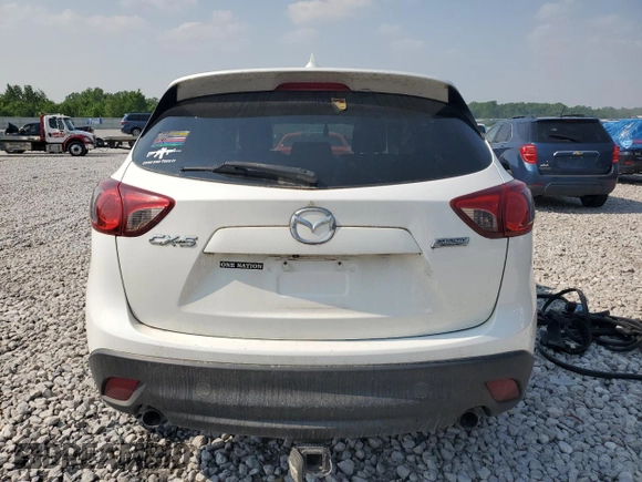 2016 Mazda CX-5 Grand Touring z VIN JM3KE4DY7G0864109, wystawiony jako Copart lot #59635865 z przebiegiem Nie podano mil oraz Czysty tytuł • Clean title. Historia ofert i sprzedaży dostępna na DreamBid. Obrazek 6.