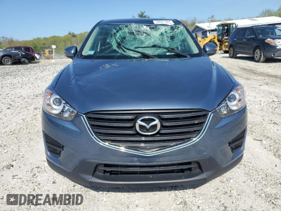 2016 Mazda CX-5 Sport with VIN JM3KE4BY8G0745522, listed as a Copart auction lot 56621825 with 98,757 mi miles and Salvage title. Bid and sale history available at DreamBid. Image 5.