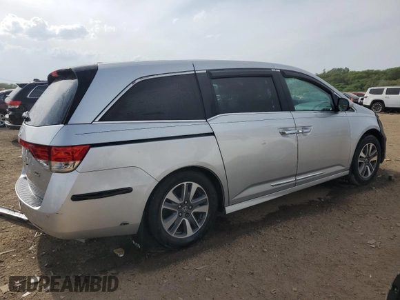 2014 Honda Odyssey Touring with VIN 5FNRL5H93EB034263, listed as a Copart auction lot 57254485 with 150,084 mi miles and Salvage title. Bid and sale history available at DreamBid. Image 3.