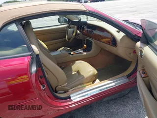 1997 Jaguar XK with VIN SAJGX2743VC017588, listed as a IAAI auction lot 42055716 with 66,052 mi miles and . Bid and sale history available at DreamBid. Image 5.