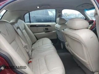 1999 Lincoln Town Car Signature with VIN 1LNHM82W7XY612906, listed as a Copart auction lot 50777435 with 110,414 mi miles and Salvage title. Bid and sale history available at DreamBid. Image 10.