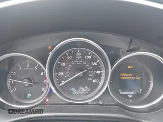 2014 Mazda CX-5 Grand Touring with VIN JM3KE4DY0E0392476, listed as a IAAI auction lot 41419144 with 89,245 mi miles and . Bid and sale history available at carsss.com. Image 7.