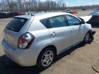 2009 Pontiac Vibe with VIN 5Y2SM67049Z409441, listed as a IAAI auction lot 41873091 with 145,169 mi miles. Bid and sale history available at carsss.com. Image 4.