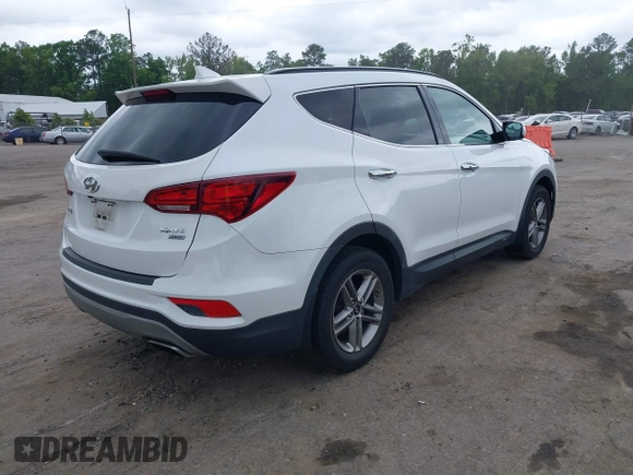 2018 Hyundai Santa Fe 2.4L z VIN 5XYZUDLB1JG543837, wystawiony jako IAAI lot #42235471 z przebiegiem 157 909 mil mil oraz . Historia ofert i sprzedaży dostępna na DreamBid. Obrazek 4.