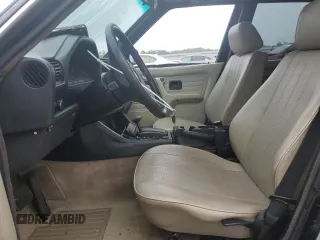 1986 BMW 3 Series 325e z VIN WBAAE640XG1705697, wystawiony jako Copart lot #74269484 z przebiegiem 168 488 mil mil oraz Szkoda całkowita • Salvage title. Historia ofert i sprzedaży dostępna na DreamBid. Obrazek 7.