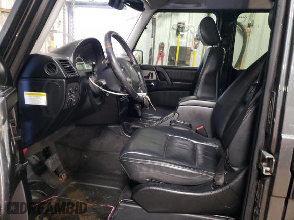 2005 Mercedes-Benz G with VIN WDCYR71E65X160243, listed as a Copart auction lot 48140075 with 164,457 mi miles and Salvage Title. Bid and sale history available at DreamBid. Image 7.