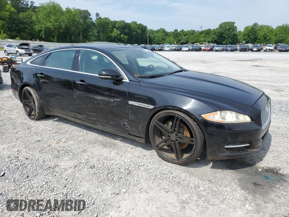 2014 Jaguar XJ with VIN SAJWA2GZ7E8V60213, listed as a Copart auction lot 53382454 with 88,870 mi miles and Salvage Title. Bid and sale history available at carsss.com. Image 4.