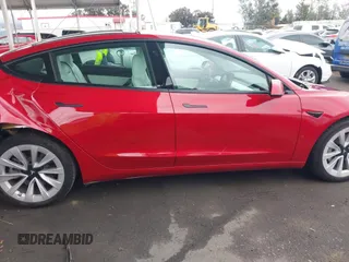 2021 Tesla Model 3 Long Range with VIN 5YJ3E1EB3MF862392, listed as a IAAI auction lot 41765987 with 51,915 mi miles and . Bid and sale history available at DreamBid. Image 12.