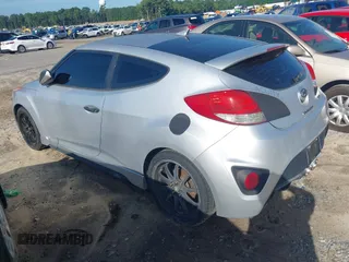 2013 Hyundai Veloster Turbo with VIN KMHTC6AE5DU112756, listed as a IAAI auction lot 42854505 with 99,015 mi miles and . Bid and sale history available at DreamBid. Image 3.
