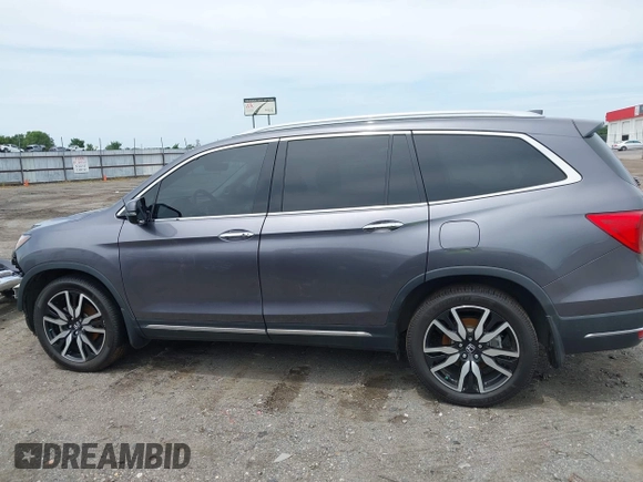 2019 Honda Pilot Touring 8-Passenger with VIN 5FNYF5H93KB028641, listed as a IAAI auction lot 42524078 with 56,744 mi miles and . Bid and sale history available at DreamBid. Image 15.