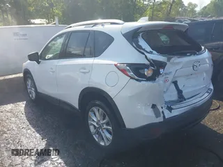 2014 Mazda CX-5 Grand Touring with VIN JM3KE2DY1E0424890, listed as a IAAI auction lot 42052437 with 107,793 mi miles. Bid and sale history available at carsss.com. Image 3.