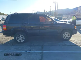 1998 Jeep Grand Cherokee Limited with VIN 1J4GX78Y8WC110325, listed as a IAAI auction lot 41357373 with 165,106 mi miles. Bid and sale history available at carsss.com. Image 13.