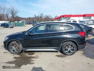 2019 BMW X1 xDrive28i with VIN WBXHT3C51K5L89758, listed as a IAAI auction lot 41535652 with 96,612 mi miles. Bid and sale history available at carsss.com. Image 14.