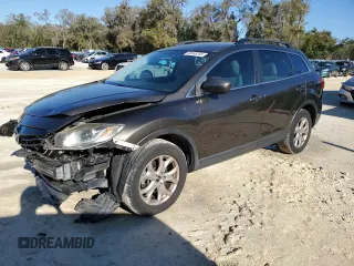 2015 Mazda CX-9 Sport z VIN JM3TB2BAXF0454197, wystawiony jako Copart lot #48566785 z przebiegiem 95 376 mil mil oraz Szkoda całkowita • Salvage title. Historia ofert i sprzedaży dostępna na DreamBid. Obrazek 1.