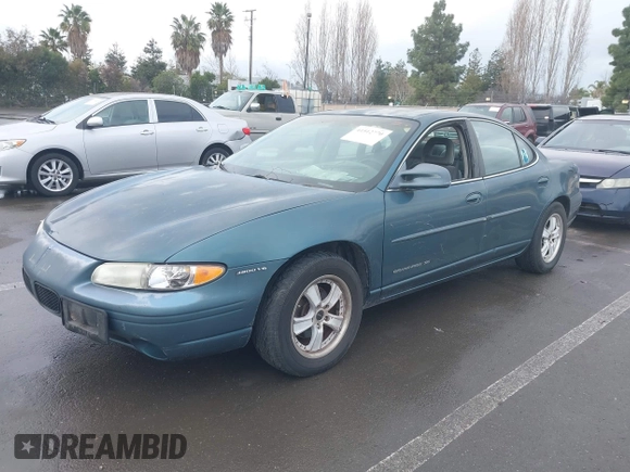 1997 Pontiac Grand Prix SE with VIN 1G2WJ52K0VF249961, listed as a IAAI auction lot 41512770 with 168,408 mi miles. Bid and sale history available at carsss.com. Image 2.