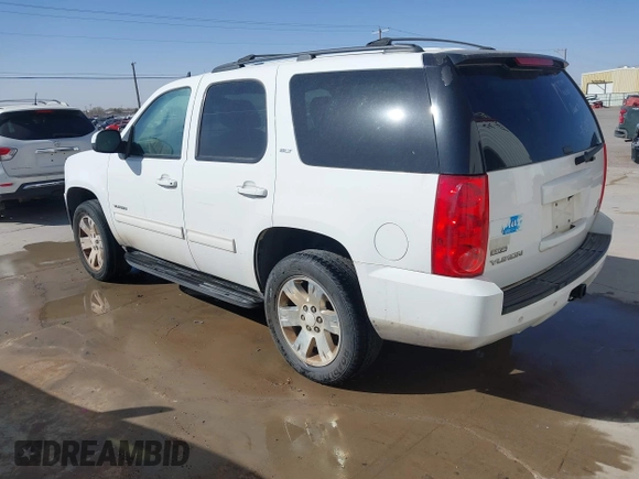 2011 GMC Yukon SLT with VIN 1GKS2CE03BR397395, listed as a IAAI auction lot 41813501 with 220,443 mi miles. Bid and sale history available at carsss.com. Image 3.
