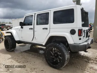 2015 Jeep Wrangler Unlimited Wrangler X with VIN 1C4BJWEG6FL614671, listed as a Copart auction lot 62286095 with 94,928 mi miles and Salvage title. Bid and sale history available at DreamBid. Image 2.