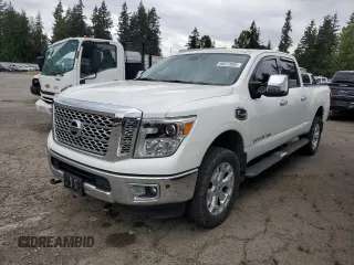 2016 Nissan Titan SL z VIN 1N6BA1F43GN517244, wystawiony jako Copart lot #56672005 z przebiegiem 93 500 mil mil oraz Czysty tytuł • Clean title. Historia ofert i sprzedaży dostępna na DreamBid. Obrazek 1.