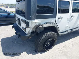 2010 Jeep Wrangler z VIN 1J4HB5H16AL186600, wystawiony jako IAAI lot #42147992 z przebiegiem 134 717 mil mil oraz . Historia ofert i sprzedaży dostępna na DreamBid. Obrazek 6.