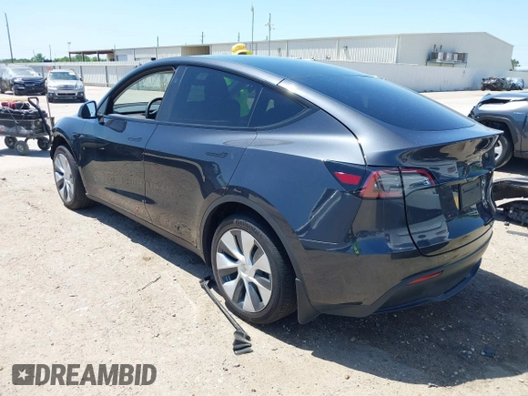 2024 Tesla Model Y with VIN 7SAYGDED2RF040745, listed as a IAAI auction lot 41986613 with 9,778 mi miles and . Bid and sale history available at DreamBid. Image 3.