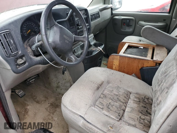 1999 GMC Savana z VIN 1GDFG15R3X1157847, wystawiony jako Copart lot #79041264 z przebiegiem 208 719 mil mil oraz Szkoda całkowita • Salvage title. Historia ofert i sprzedaży dostępna na DreamBid. Obrazek 7.