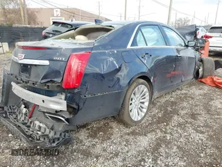 2016 Cadillac CTS Luxury Collection AWD with VIN 1G6AX5SX5G0180953, listed as a IAAI auction lot 41005332 with Not Provided miles and . Bid and sale history available at DreamBid. Image 4.