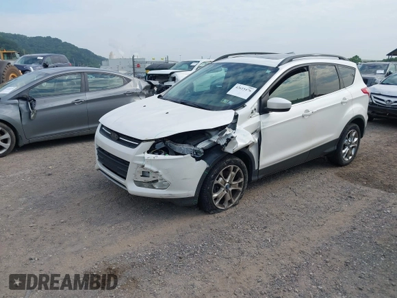 2014 Ford Escape SE with VIN 1FMCU9G99EUA09575, listed as a IAAI auction lot 42615476 with 107,948 mi miles and . Bid and sale history available at DreamBid. Image 2.
