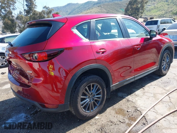 2019 Mazda CX-5 Sport with VIN JM3KFABM0K1633065, listed as a IAAI auction lot 41968786 with 90,407 mi miles and . Bid and sale history available at DreamBid. Image 4.