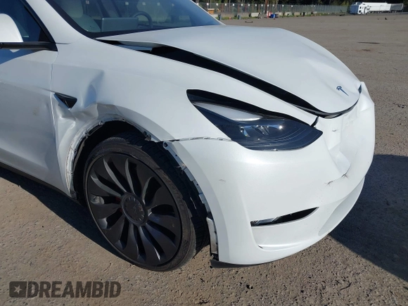 2023 Tesla Model Y Performance with VIN 7SAYGDEF2PF754938, listed as a IAAI auction lot 42067041 with 21,103 mi miles and . Bid and sale history available at DreamBid. Image 6.