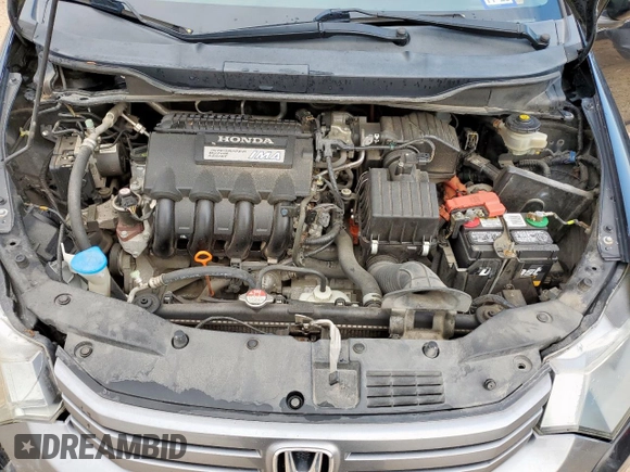 2010 Honda Insight EX z VIN JHMZE2H72AS038002, wystawiony jako Copart lot #58484365 z przebiegiem 178 670 mil mil oraz Szkoda całkowita • Salvage title. Historia ofert i sprzedaży dostępna na DreamBid. Obrazek 11.