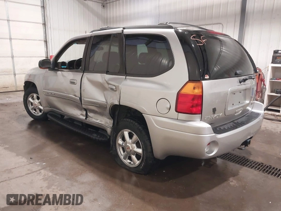 2004 GMC Envoy SLE with VIN 1GKDT13S042243883, listed as a IAAI auction lot 41795335 with 162,873 mi miles. Bid and sale history available at carsss.com. Image 3.