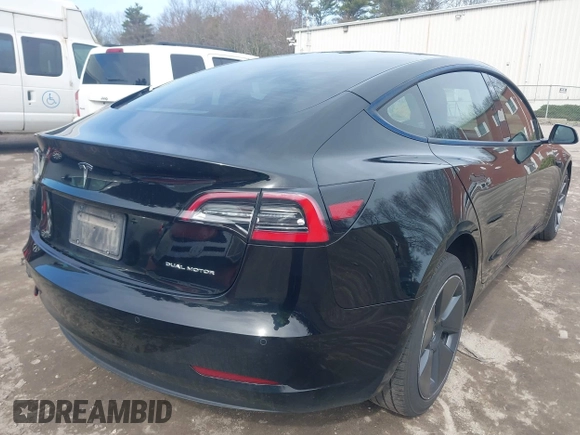 2022 Tesla Model 3 Long Range with VIN 5YJ3E1EBXNF177128, listed as a IAAI auction lot 41966089 with 75,140 mi miles and . Bid and sale history available at DreamBid. Image 4.