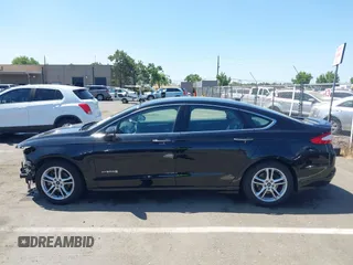 2016 Ford Fusion Titanium Hybrid z VIN 3FA6P0RUXGR123445, wystawiony jako IAAI lot #42606596 z przebiegiem 145 541 mil mil oraz . Historia ofert i sprzedaży dostępna na DreamBid. Obrazek 15.